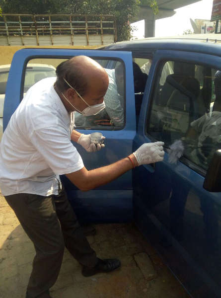 Forensic Science experts examining Arvind Kejriwal's car